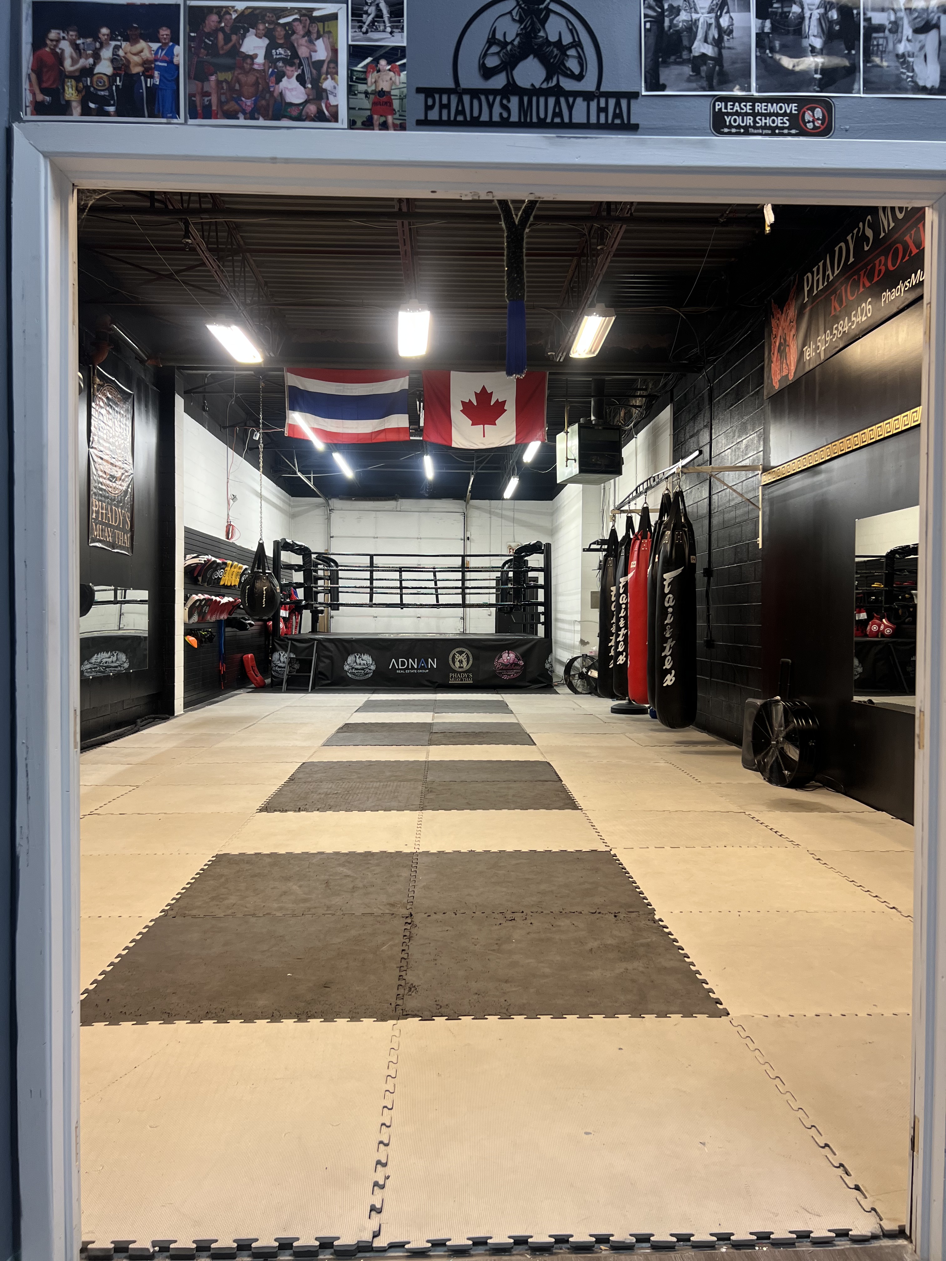 Phady's Muay Thai gym entrance with ring and heavy bags